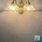 Clear Glass Floral Vanity Light with Gold Arc Arm for Bathroom